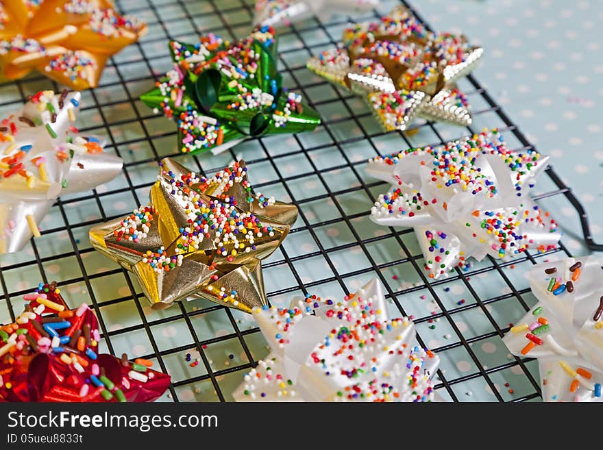 Candy Bows with sprinkles on top a baking rack. Candy Bows with sprinkles on top a baking rack.