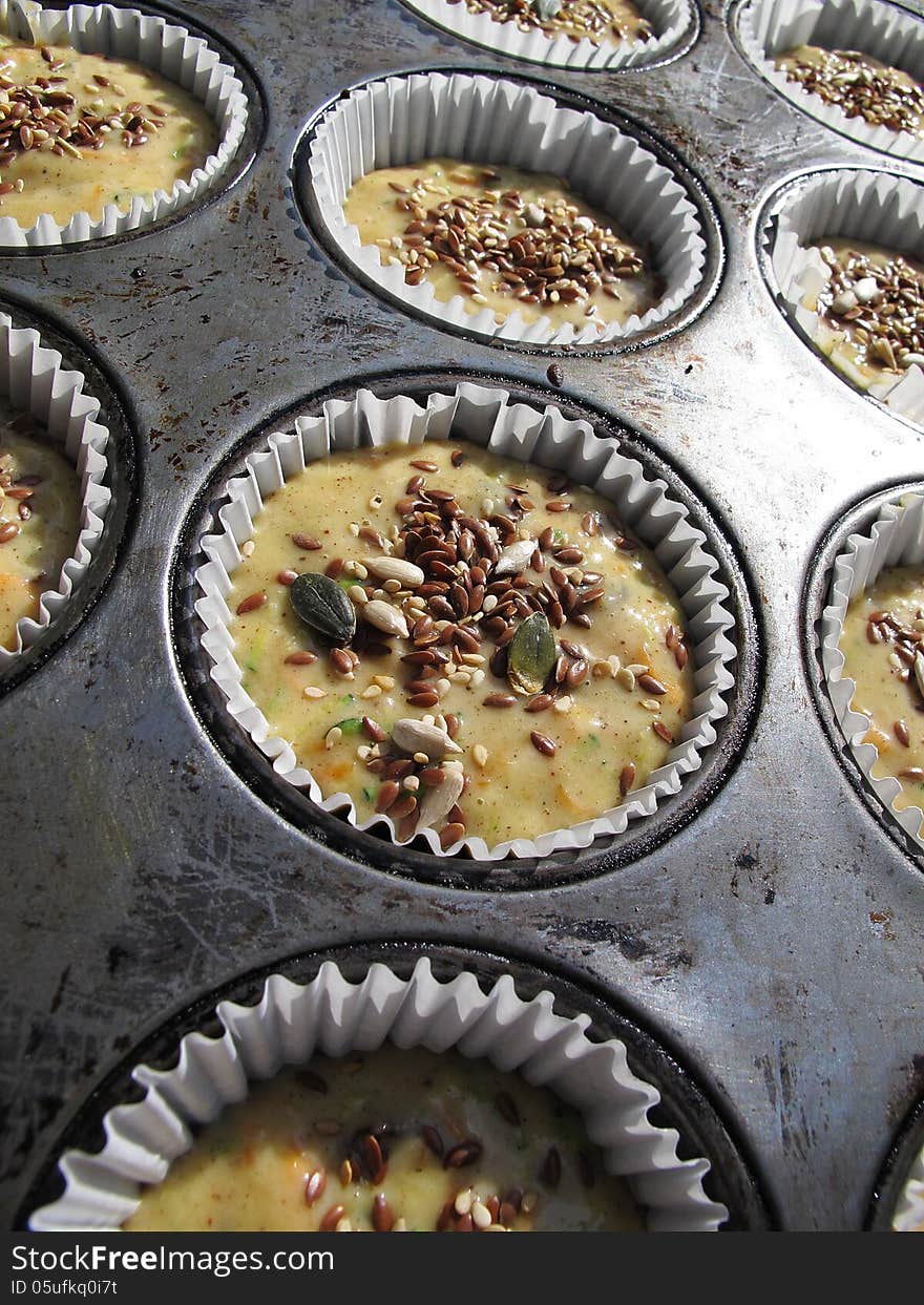 Raw muffins in tin before baking