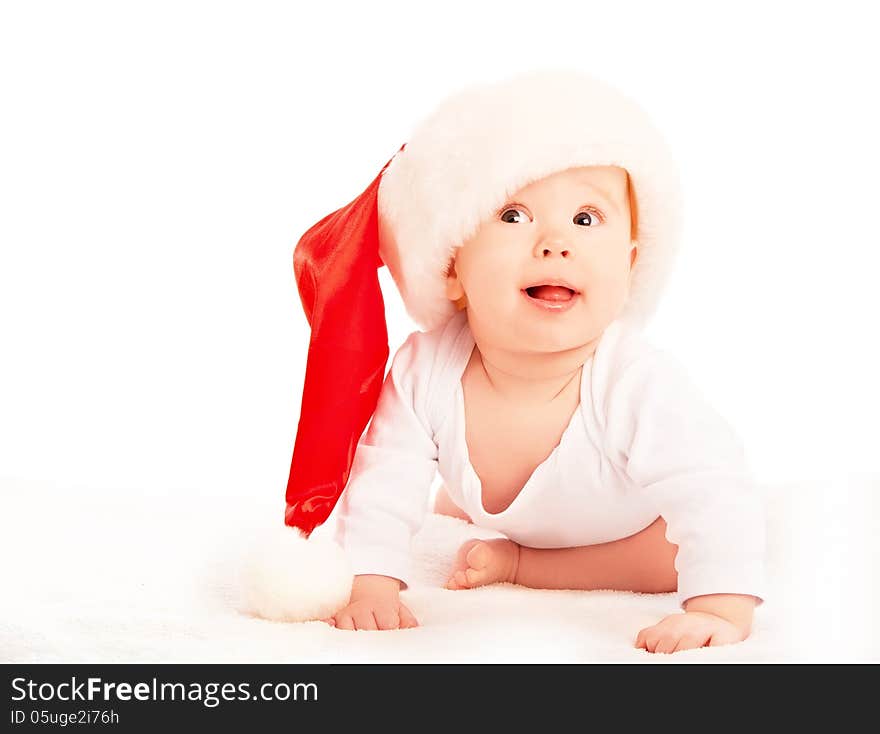 Beautiful baby in a Christmas hat isolated on white background