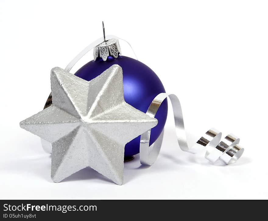 Blue bauble with thesilver star on the white background. Blue bauble with thesilver star on the white background