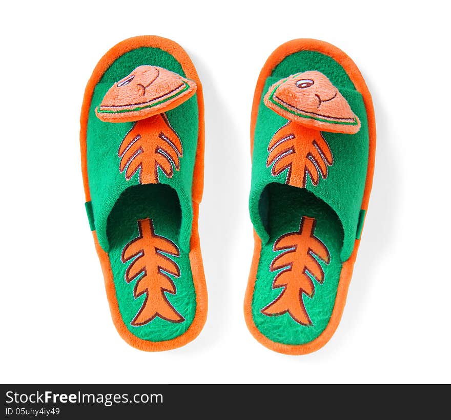 Pair of comfortable slippers with a picture of a funny fish on a white background with clipping path. Pair of comfortable slippers with a picture of a funny fish on a white background with clipping path