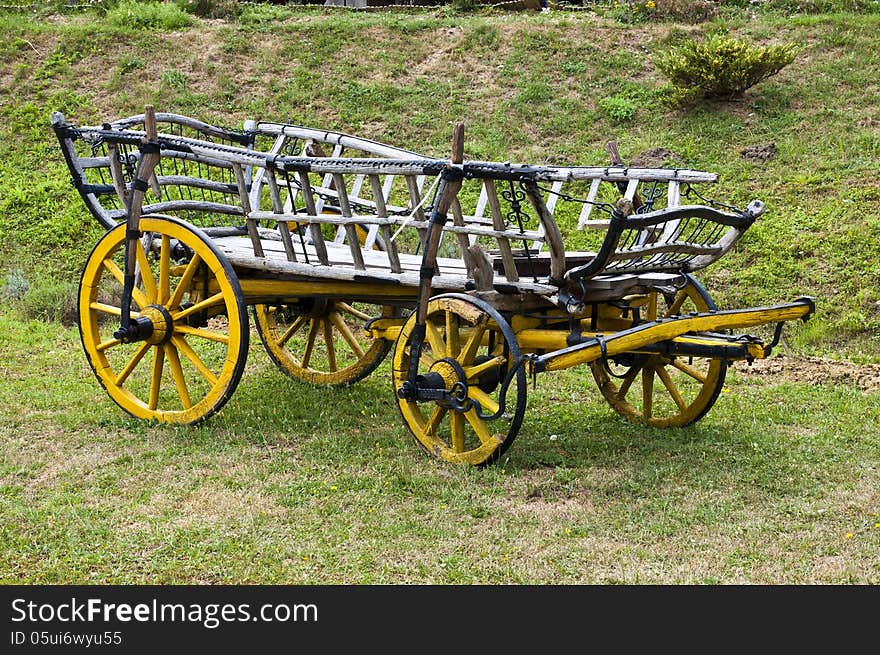 Old wooden carts, placed on the lawn. Old wooden carts, placed on the lawn