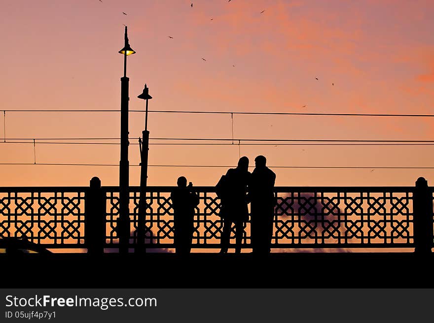 Couple making pictures on the Galata bridge