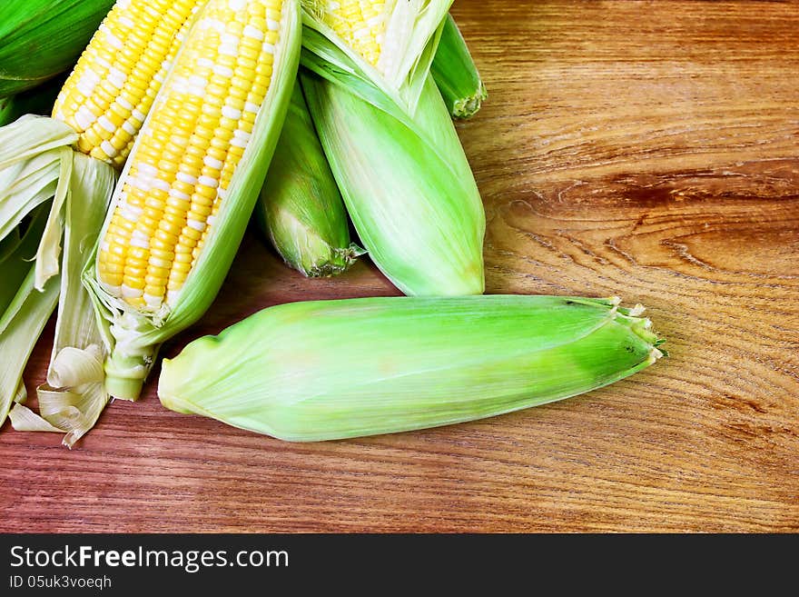 Corn fresh from the farm on the wooden table