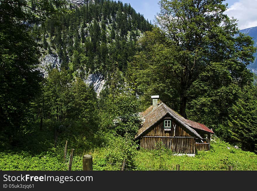 House in the mountains above the village hallstatt. House in the mountains above the village hallstatt