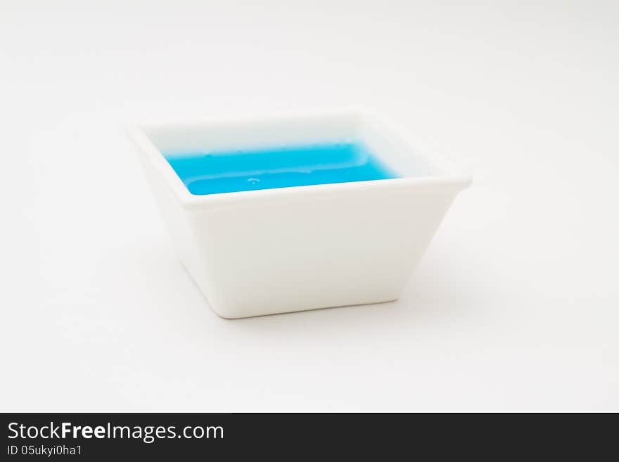 Blue sauce in white crockery