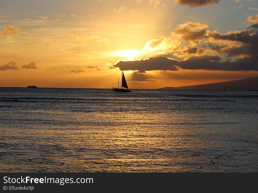 Ship in the ocean during sunset time. Ship in the ocean during sunset time