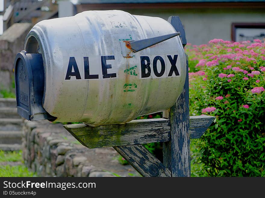 A unique and humorous mailbox made from converted beer keg, closeup. The picture was taken at Barley Creek Brewing Company, Tannersville PA. A unique and humorous mailbox made from converted beer keg, closeup. The picture was taken at Barley Creek Brewing Company, Tannersville PA.