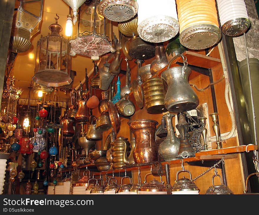 Antique eastern cooking utensils in a junk shop. Antique eastern cooking utensils in a junk shop