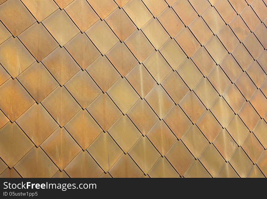 Gold-coloured Metal Scales On Modern Building 1