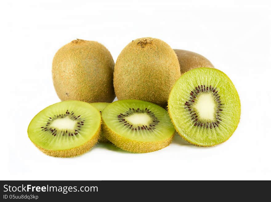 Whole kiwi fruit and his sliced segments isolated on white background. Whole kiwi fruit and his sliced segments isolated on white background