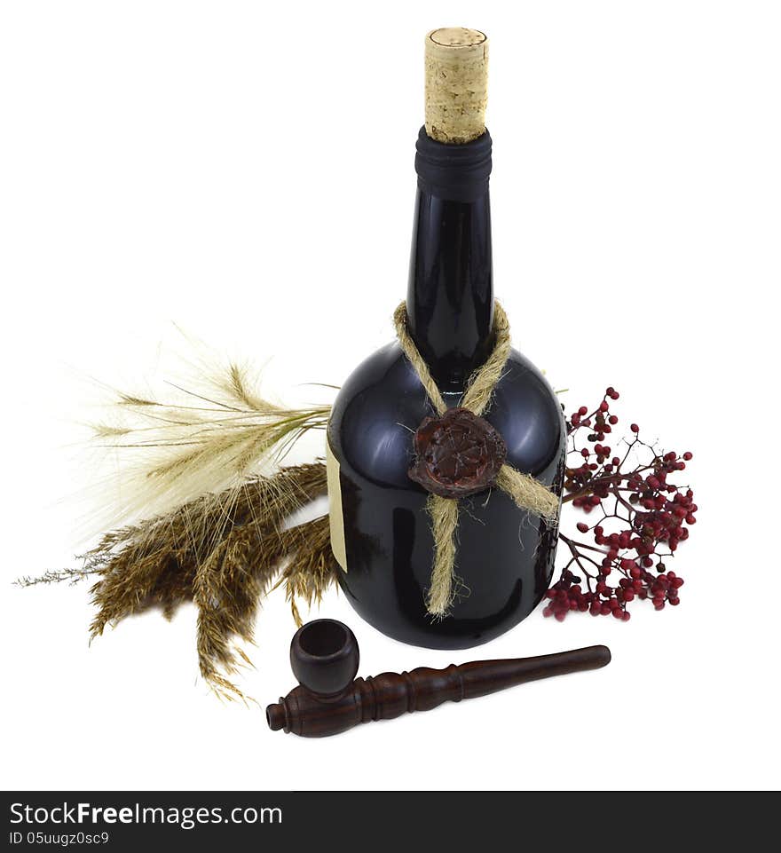 Black bottle of wine with smoking pipe isolated. Black bottle of wine with smoking pipe isolated