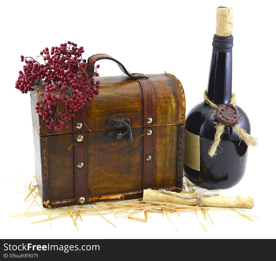 Old wooden box with bunch of red berries and bottle of wine isolated. Old wooden box with bunch of red berries and bottle of wine isolated