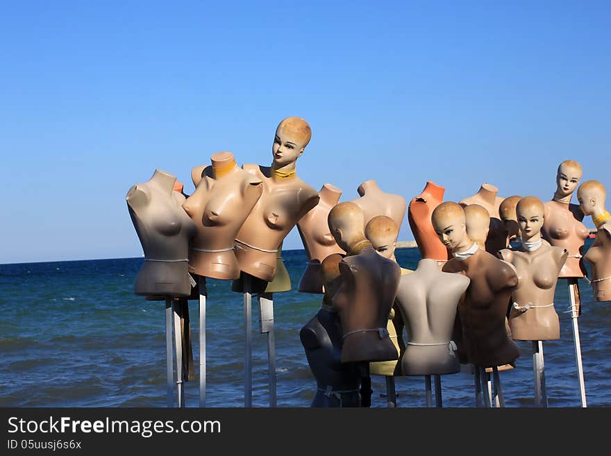 Group of dummy on beach