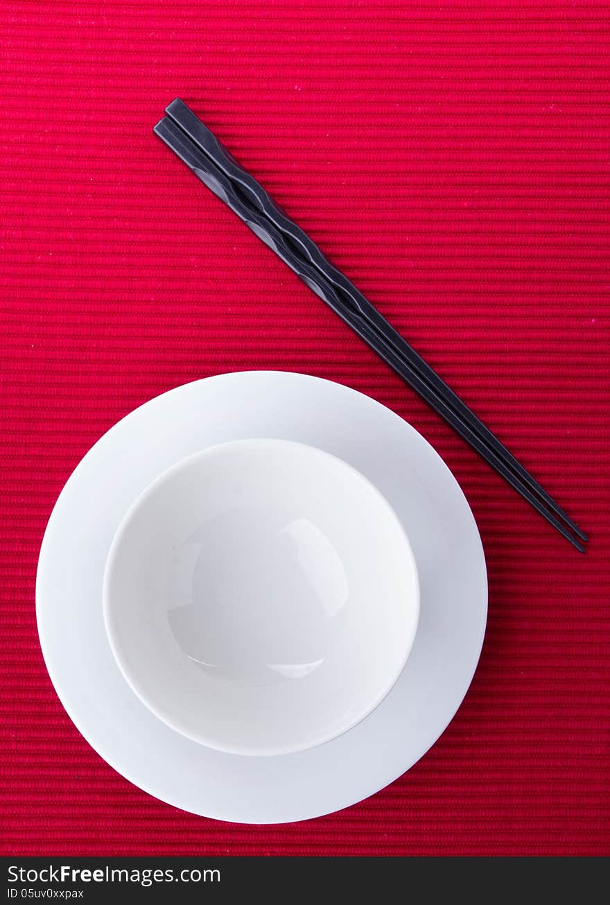 Empty bowl isolated on red background