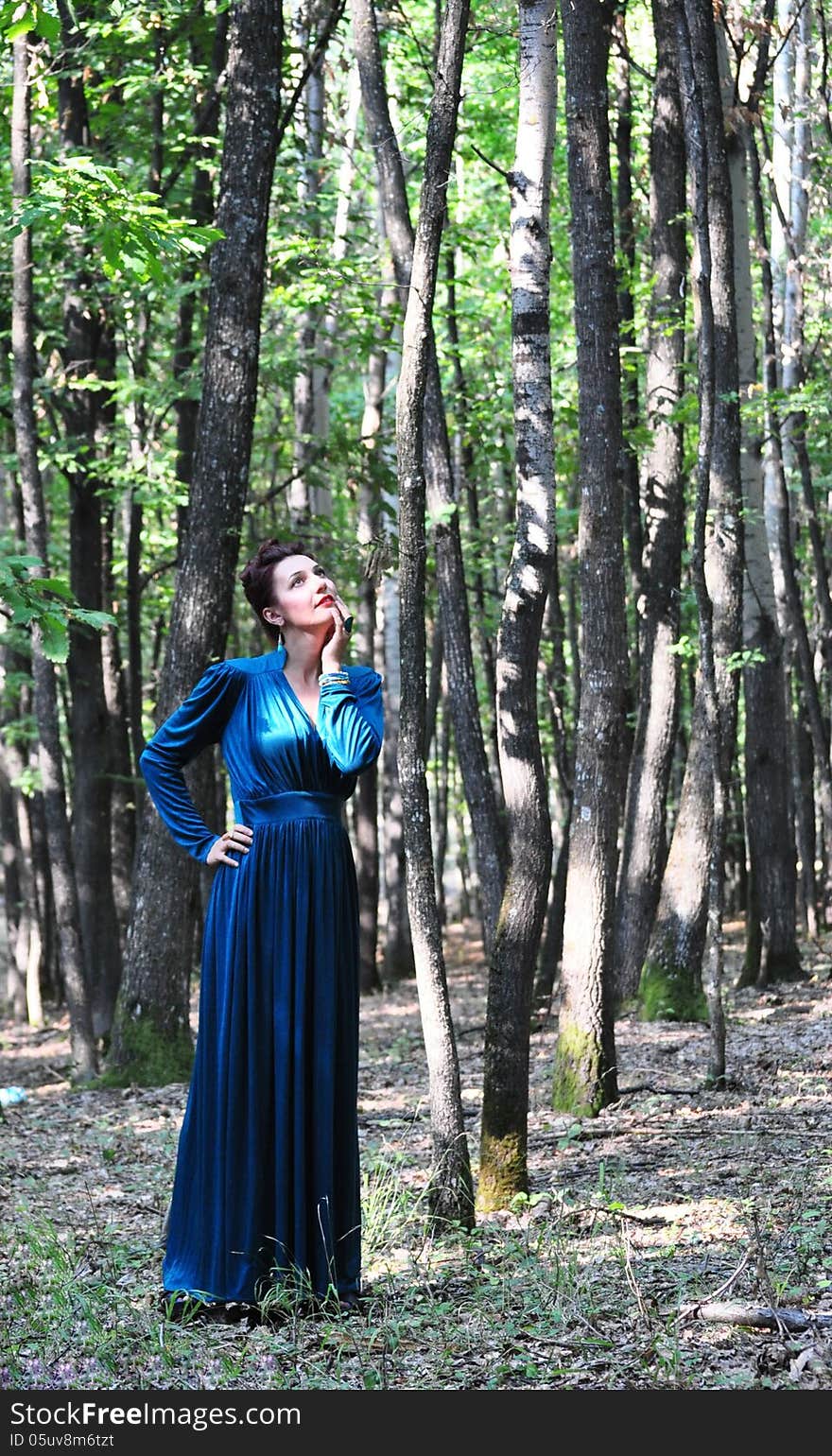 Portrait of the beautiful woman in the forest. Shooting on the nature. Portrait of the beautiful woman in the forest. Shooting on the nature.