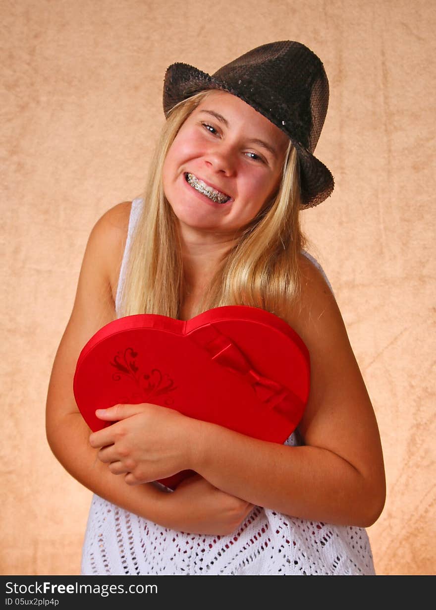 Teenage Female With Black Hat And Valentine Heart. Teenage Female With Black Hat And Valentine Heart