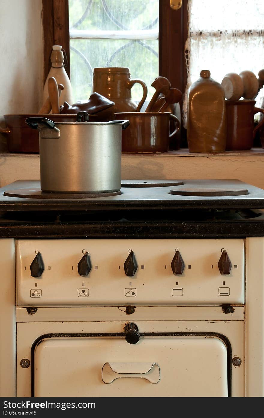 Vintage cooker with a pot in kitchen. Vintage cooker with a pot in kitchen