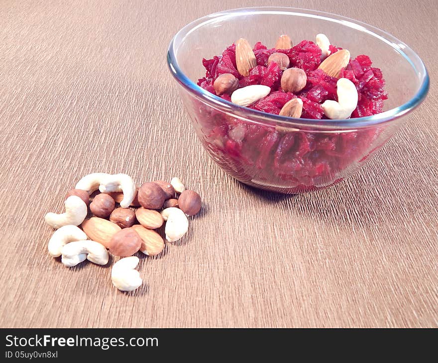 Red beet salad with walnuts, hazelnuts, peanuts