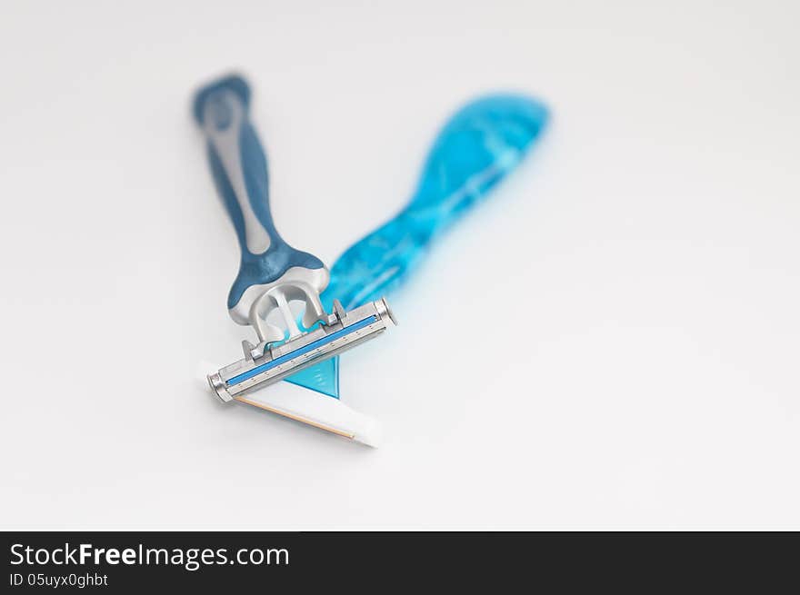 Shavers crossed on white background. Shavers crossed on white background