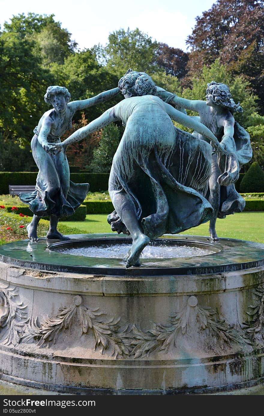 Sculpture of three dancing women.