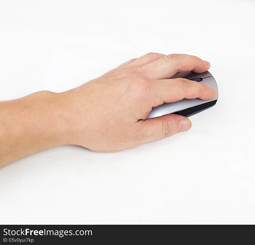 Closeup of a hand using a wireless mouse. Closeup of a hand using a wireless mouse