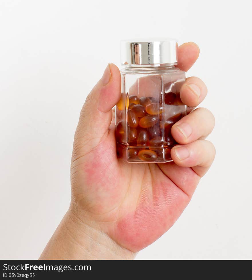 Hand and pill bottles