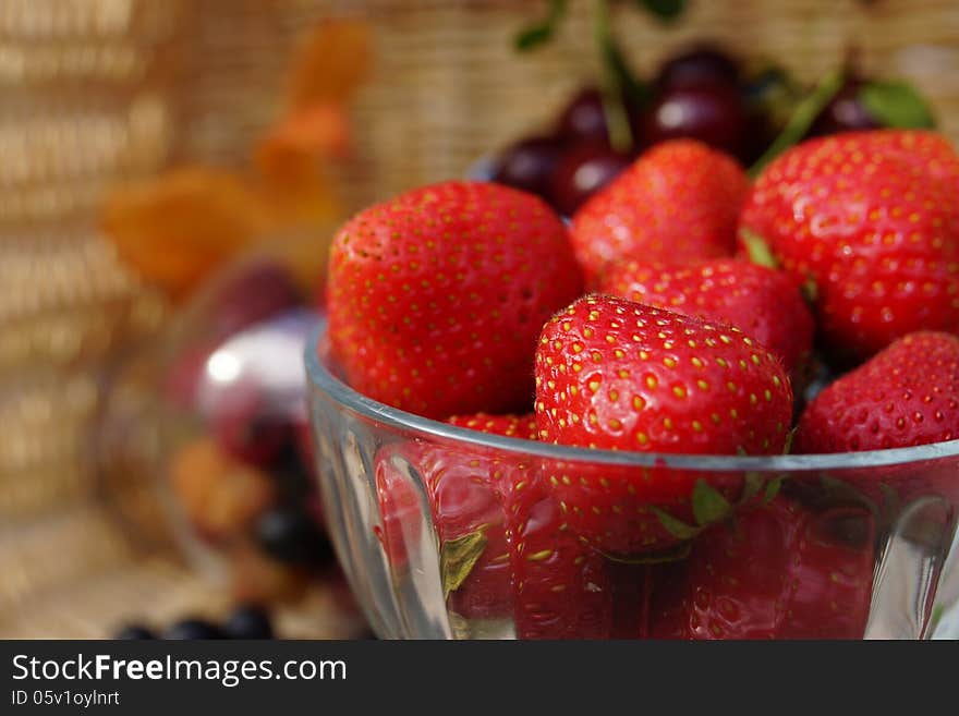 Still life of summer berries: Strawberries and Cherries.