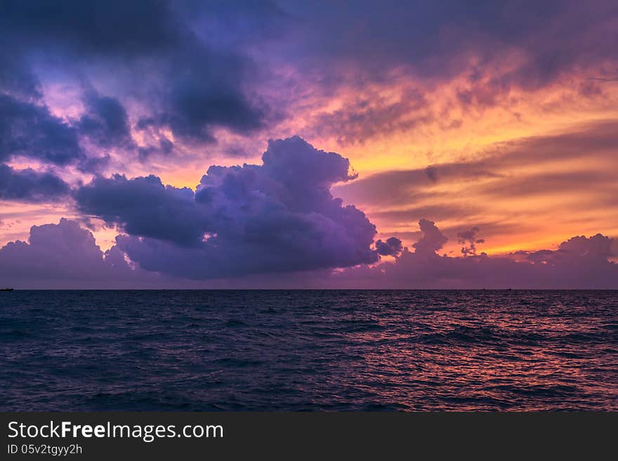 Fire sunset on the sea with clouds. Fire sunset on the sea with clouds