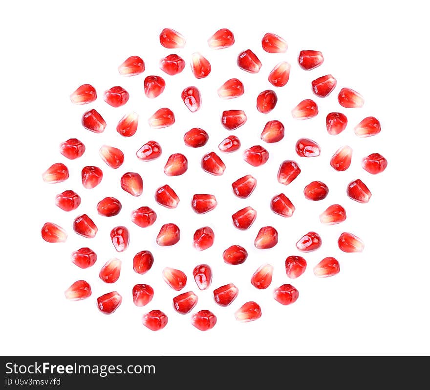 Pomegranate fruit seeds isolated on white macro background