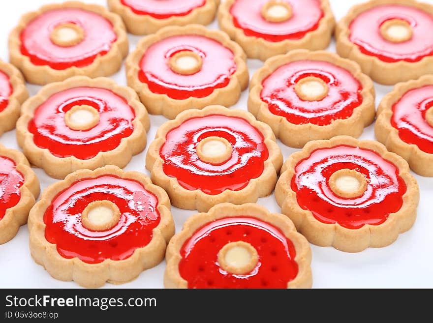 Lot of strawberry biscuits. Cllose up. White background.