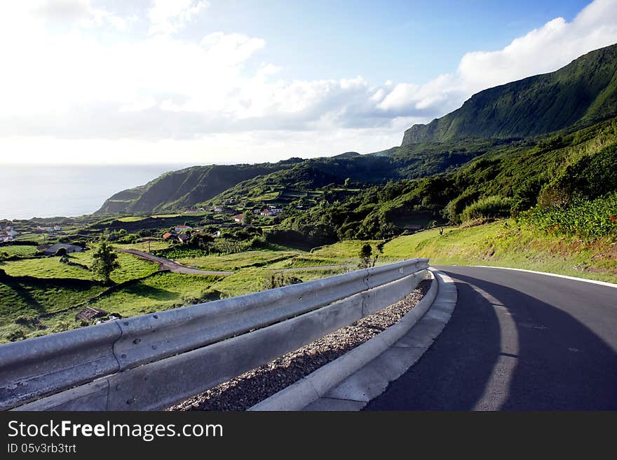 A shot of a peaceful road in the Flores island, in the Azores archipelago. A peaceful place in the middle of Atlantic Ocean. A shot of a peaceful road in the Flores island, in the Azores archipelago. A peaceful place in the middle of Atlantic Ocean.