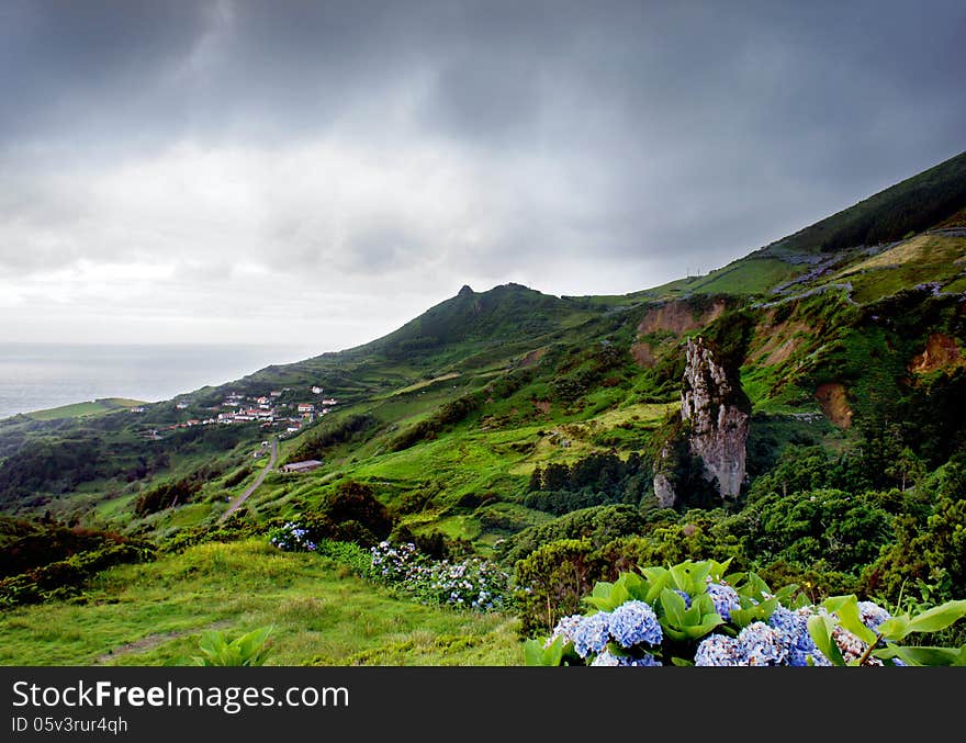 A shot of a incoming storm over a coast in the Flores island, in the Azores archipelago. A shot of a incoming storm over a coast in the Flores island, in the Azores archipelago.