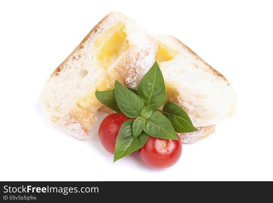 Slice cheese bread with tomatoe and basil isolated on white. Slice cheese bread with tomatoe and basil isolated on white