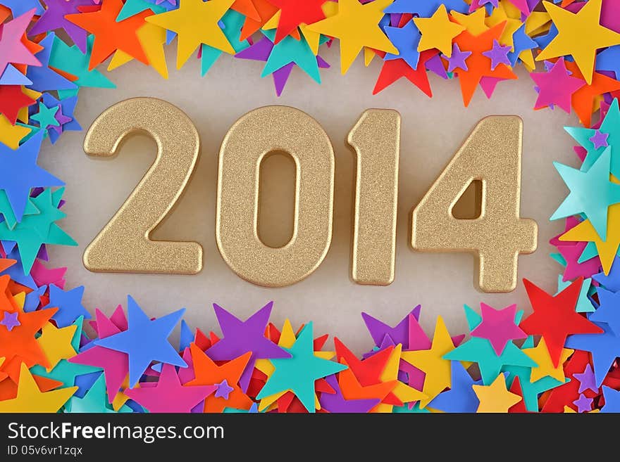 2014 year golden figures on the background of colored stars