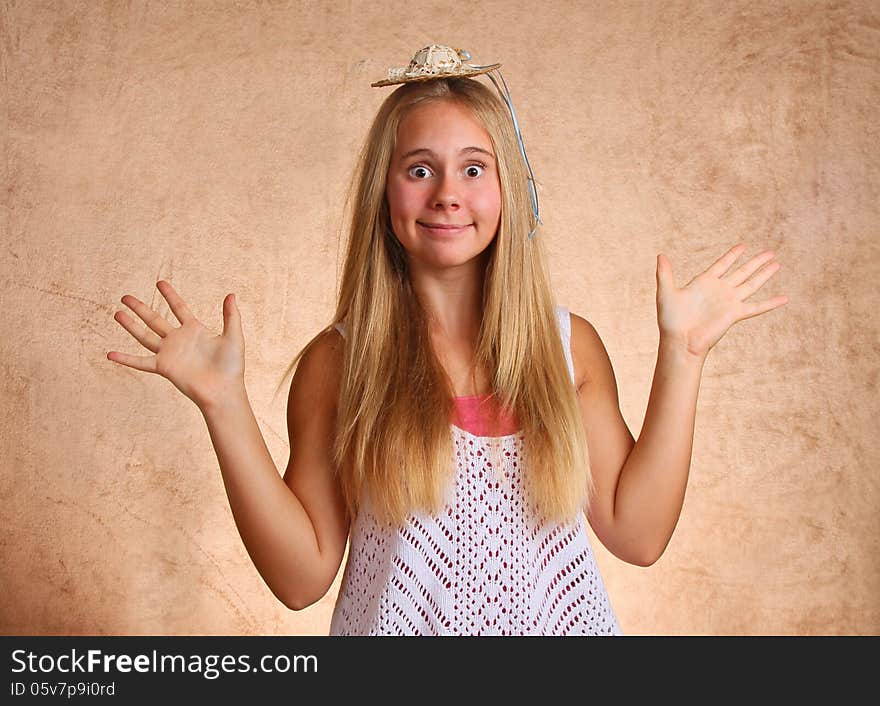 Teenage Female With Small Straw Hat and Silly Expression. Teenage Female With Small Straw Hat and Silly Expression