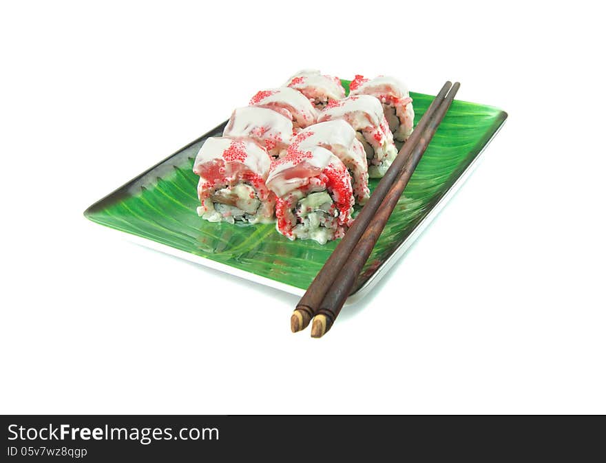 Rolls on a plate with sticks isolated on a white background