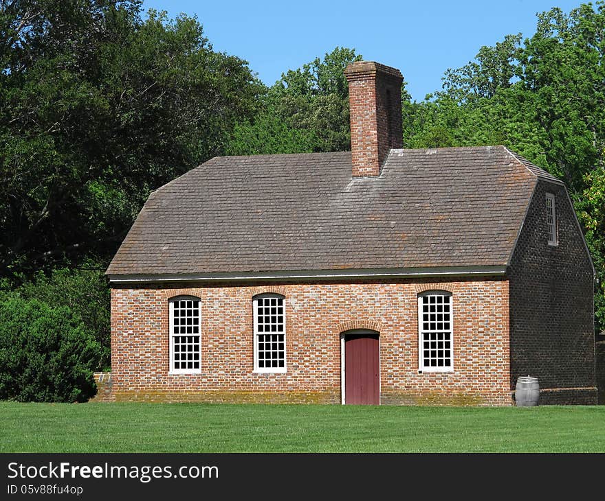 Old brick American southern plantation work building, with grass, trees, and blue sky. Old brick American southern plantation work building, with grass, trees, and blue sky.