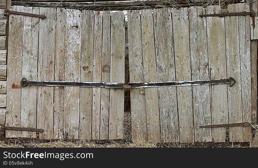 Old barn wooden gates closeup. Old barn wooden gates closeup