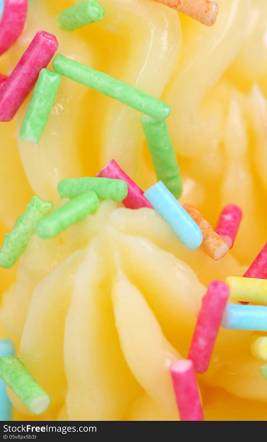 Soft lemon ise cream. Sprinkles. Close up. Background.