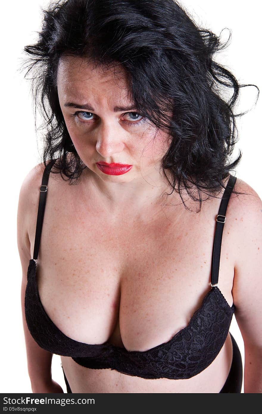 Face hurt from middle-aged woman in bra on a white background isolation. Face hurt from middle-aged woman in bra on a white background isolation