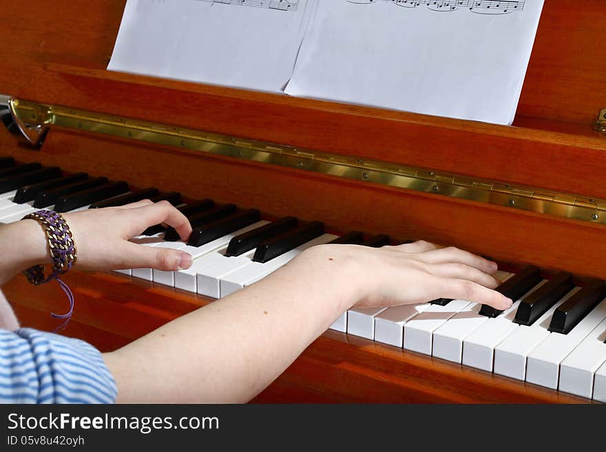 Closeup of hands playing the piano. Closeup of hands playing the piano