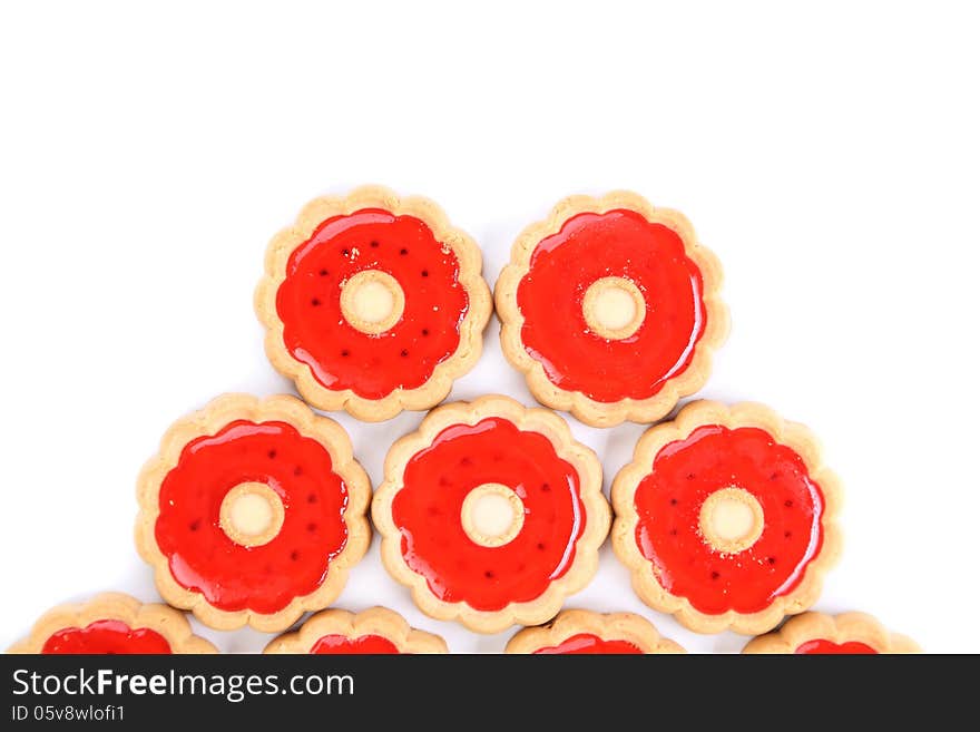 Five rings of strawberry biscuits. White background.