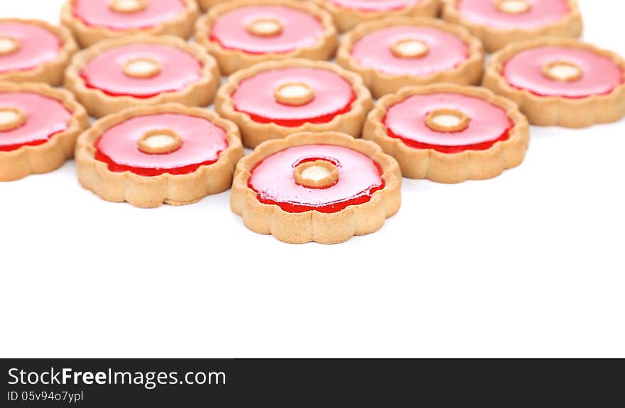 Lot of strawberry biscuits are located top background. Lot of strawberry biscuits are located top background.