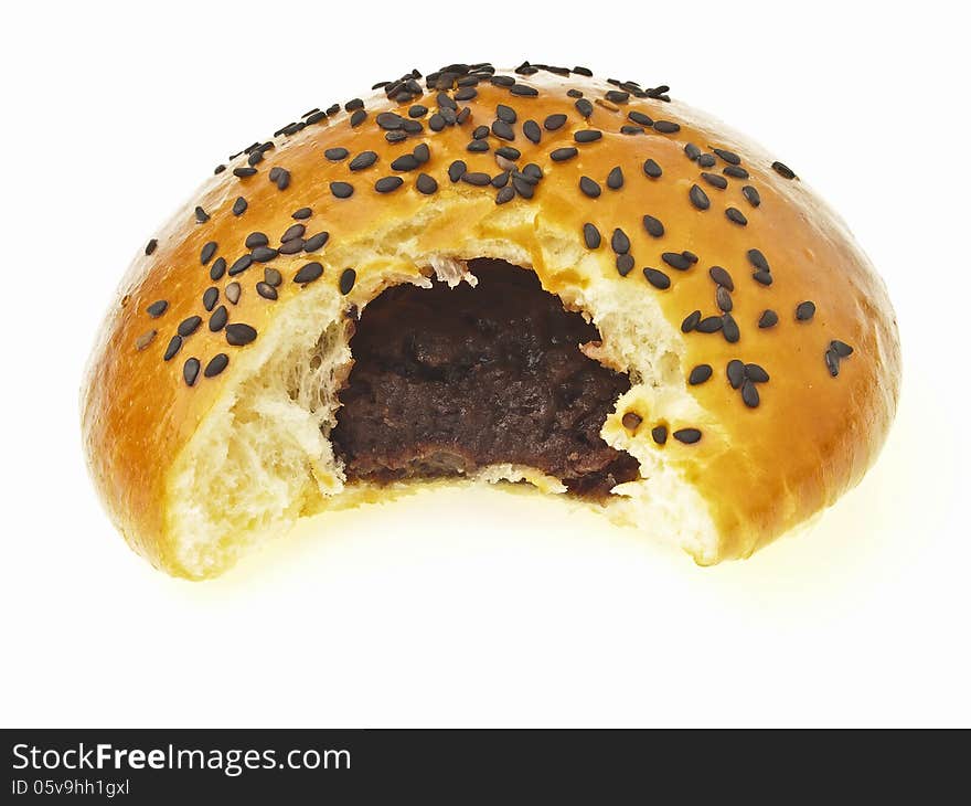 Isolation image of bite mark on delicious red bean black sesame filled bun. Isolation image of bite mark on delicious red bean black sesame filled bun