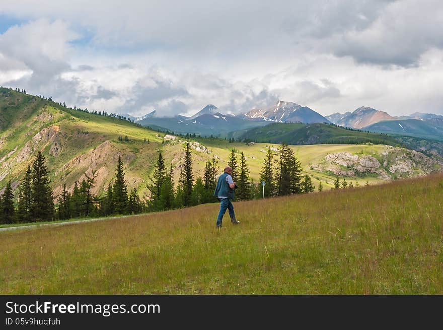 Photographer man chooses a place for landscape photography. Photographer man chooses a place for landscape photography