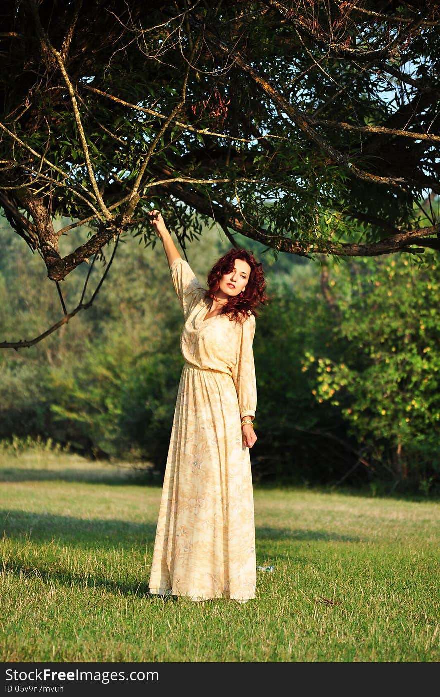 Portrait of the beautiful woman in the forest. Shooting on the nature. Portrait of the beautiful woman in the forest. Shooting on the nature.