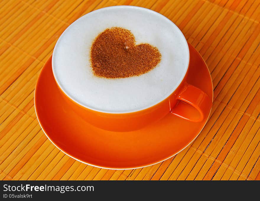 Cappuccino with heart ornament made of cinnamon. Cappuccino with heart ornament made of cinnamon