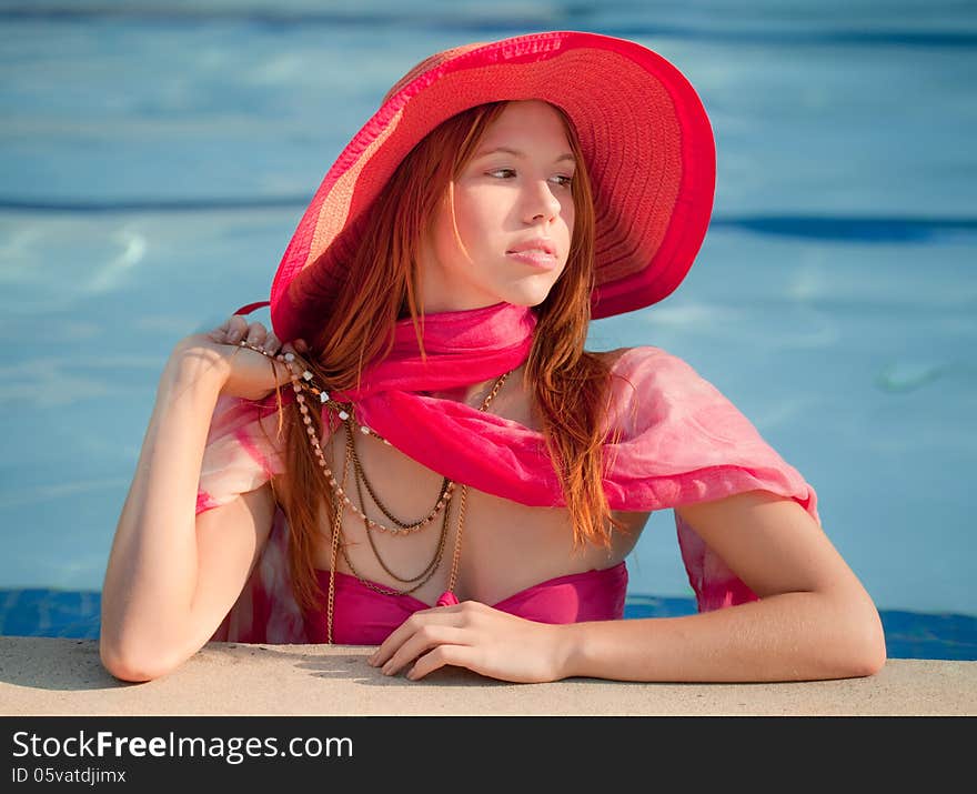 An image of a fashionable woman in a pool. An image of a fashionable woman in a pool