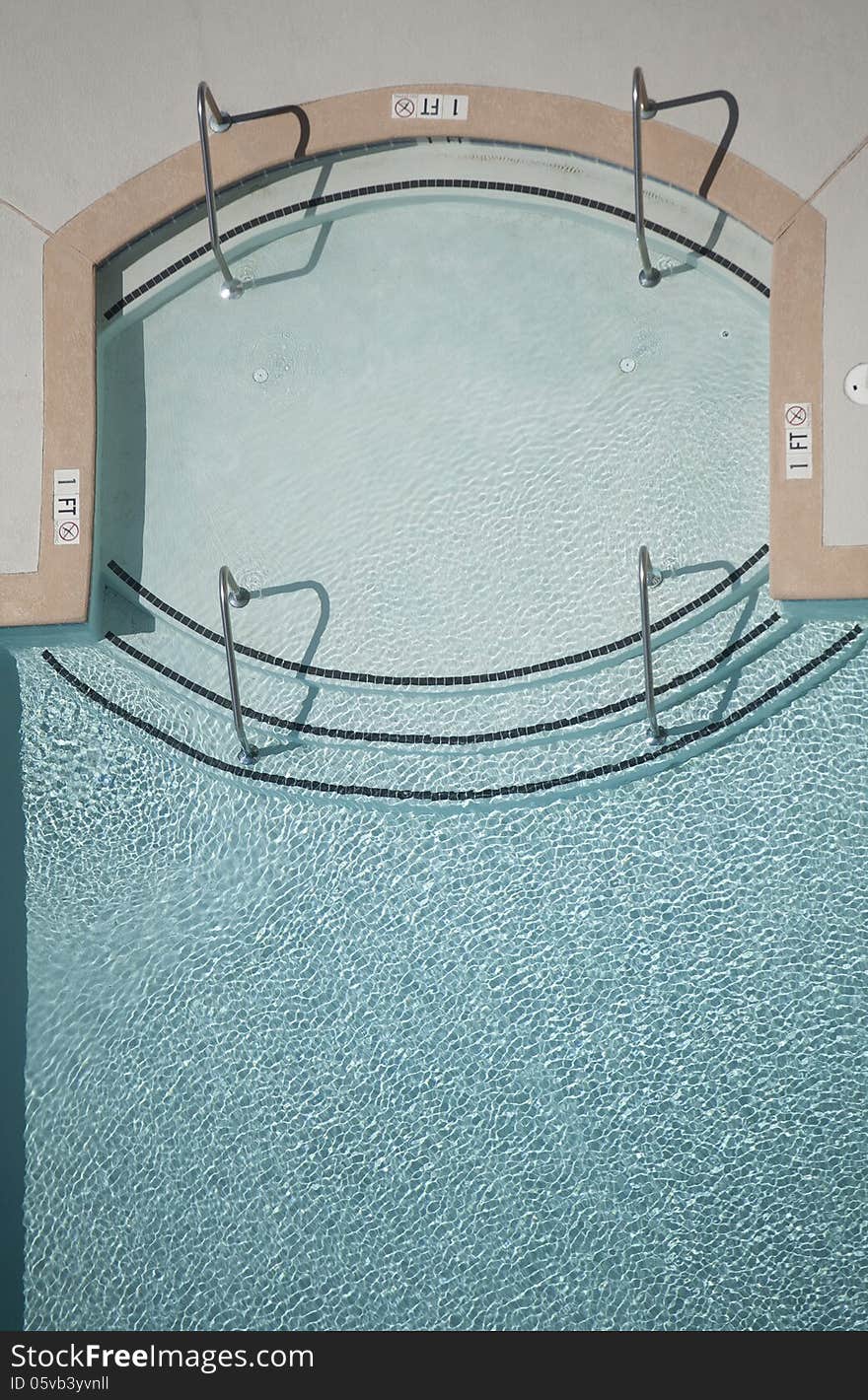 Vertical photograph of a swimming pool from overhead viewpoint